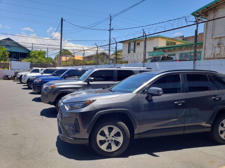 A row of cars with tinted windows